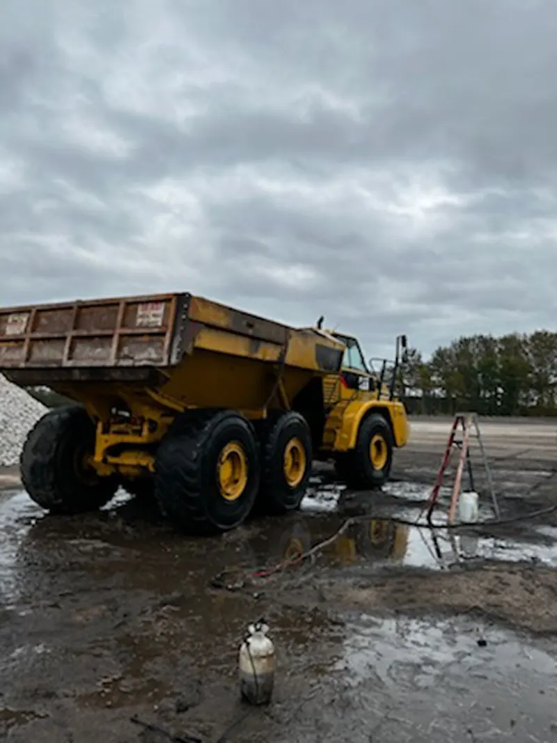 Articulated haul truck, bed and tires after